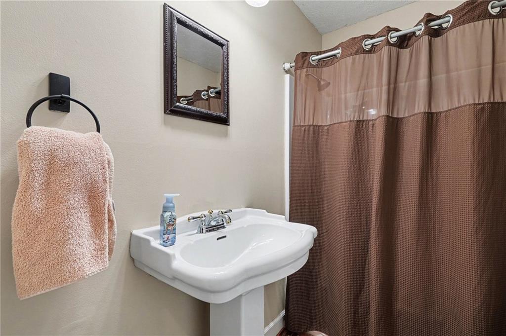 526 Antioch Church Road Talking Rock, GA 30175 - Photo 15 of 38 a bathroom with a sink and mirror
