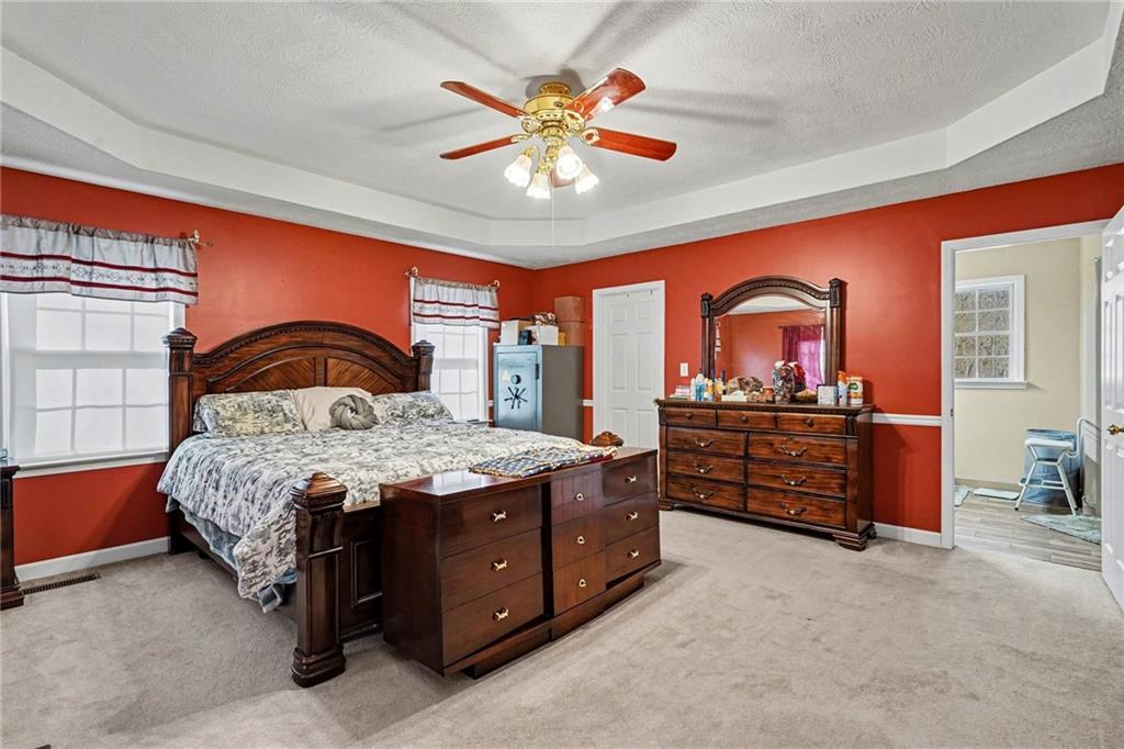 526 Antioch Church Road Talking Rock, GA 30175 - Photo 17 of 38 a bedroom with a bed and a dresser