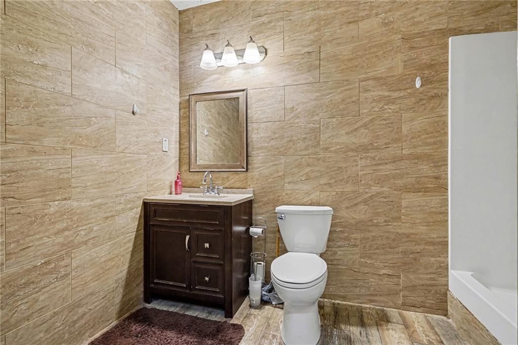526 Antioch Church Road Talking Rock, GA 30175 - Photo 23 of 38 a bathroom with a toilet a sink and mirror