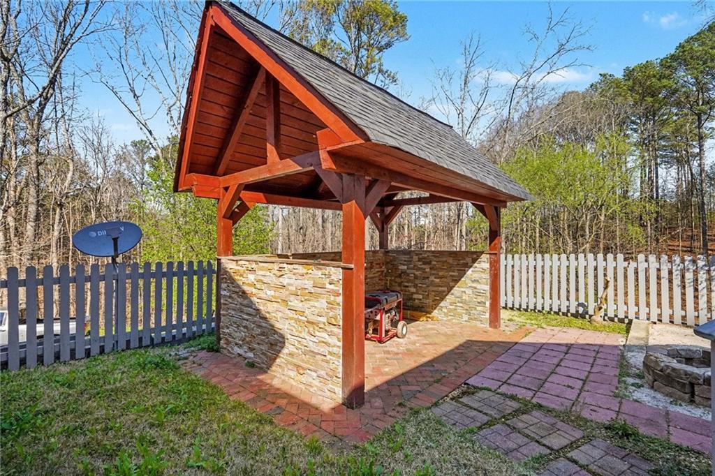 526 Antioch Church Road Talking Rock, GA 30175 - Photo 33 of 38 a front view of a house with a garden