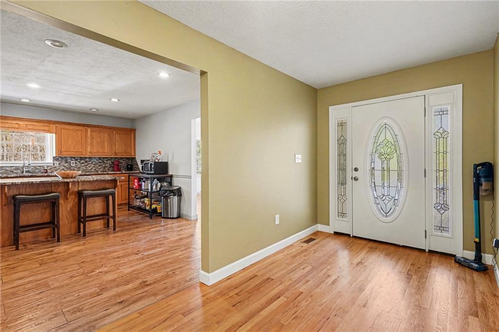 526 Antioch Church Road Talking Rock, GA 30175 - Photo 4 of 38 a view of a kitchen with furniture and wooden floor