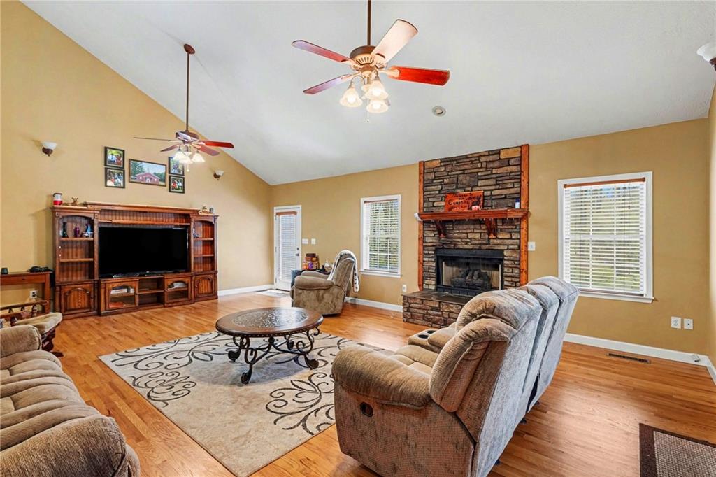526 Antioch Church Road Talking Rock, GA 30175 - Photo 5 of 38 a living room with fireplace furniture and a flat screen tv