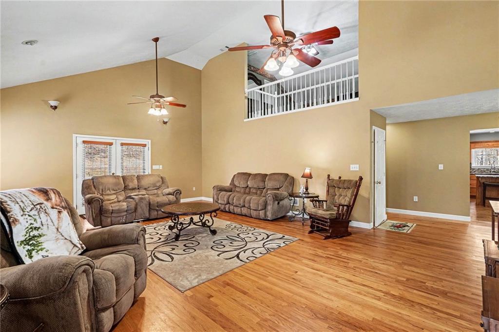 526 Antioch Church Road Talking Rock, GA 30175 - Photo 6 of 38 a living room with furniture and a chandelier