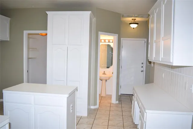 a bathroom with a sink and a washing machine