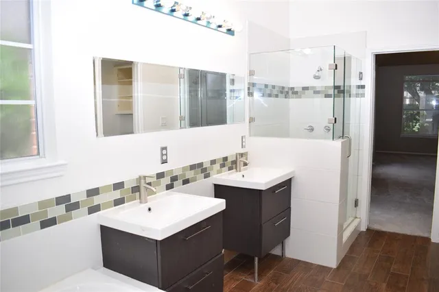a bathroom with a sink and a mirror