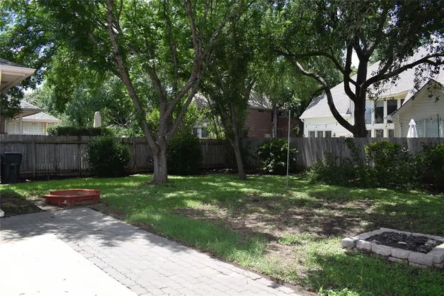 a backyard of a house with lots of green space