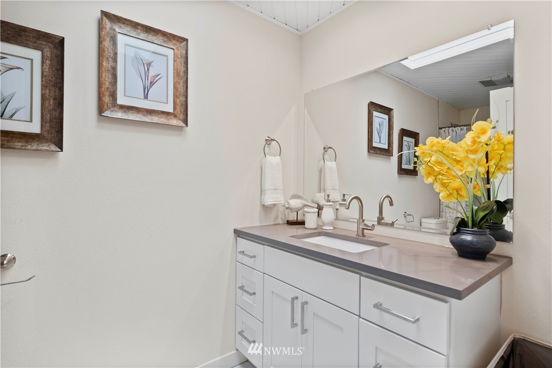 5723 Highland Road Everett, WA 98203 - Photo 18 of 21 a bathroom with a sink and a mirror