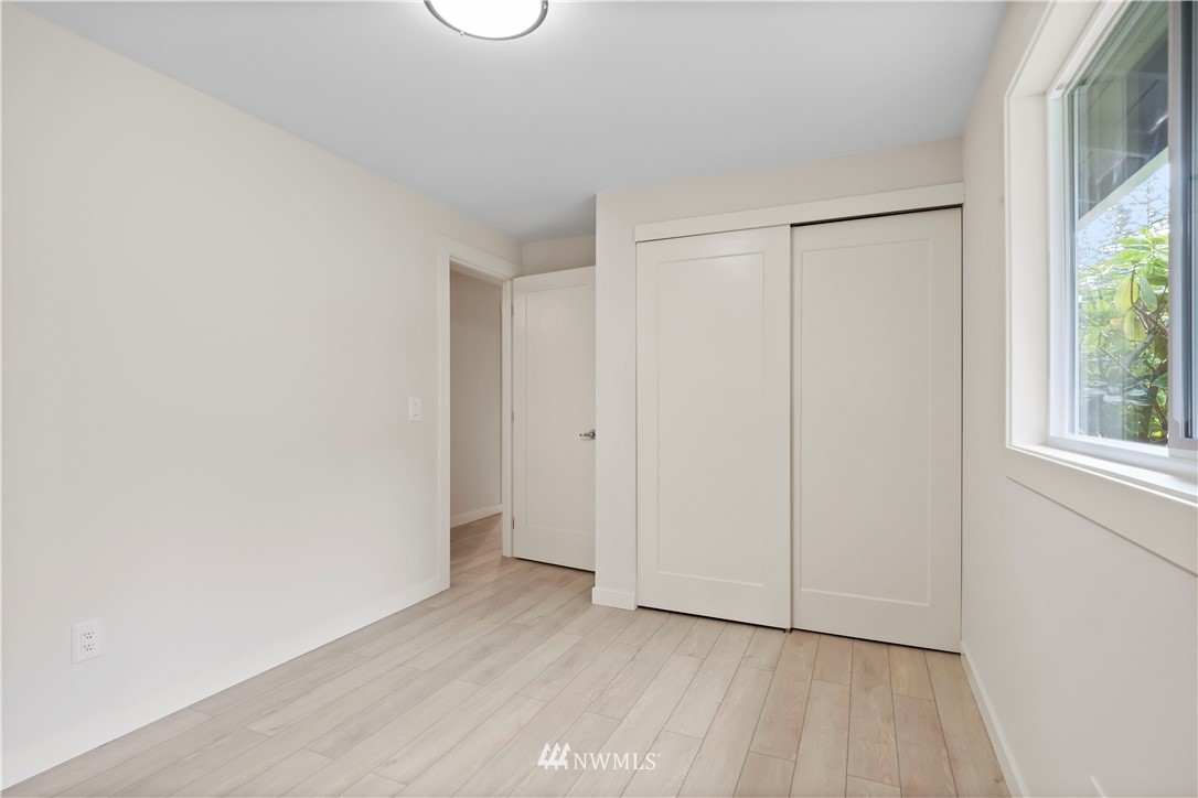 5723 Highland Road Everett, WA 98203 - Photo 19 of 21 a view of an empty room with wooden floor and a window