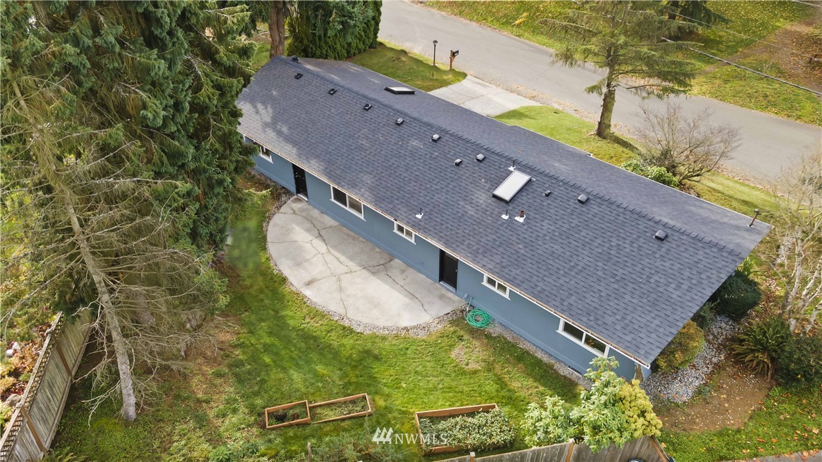 5723 Highland Road Everett, WA 98203 - Photo 21 of 21 an aerial view of a house with a yard and lake view