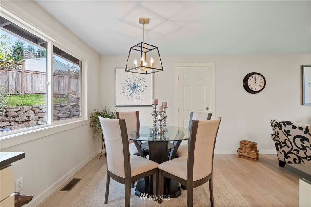 5723 Highland Road Everett, WA 98203 - Photo 8 of 21 a view of a dining room with furniture window and outside view