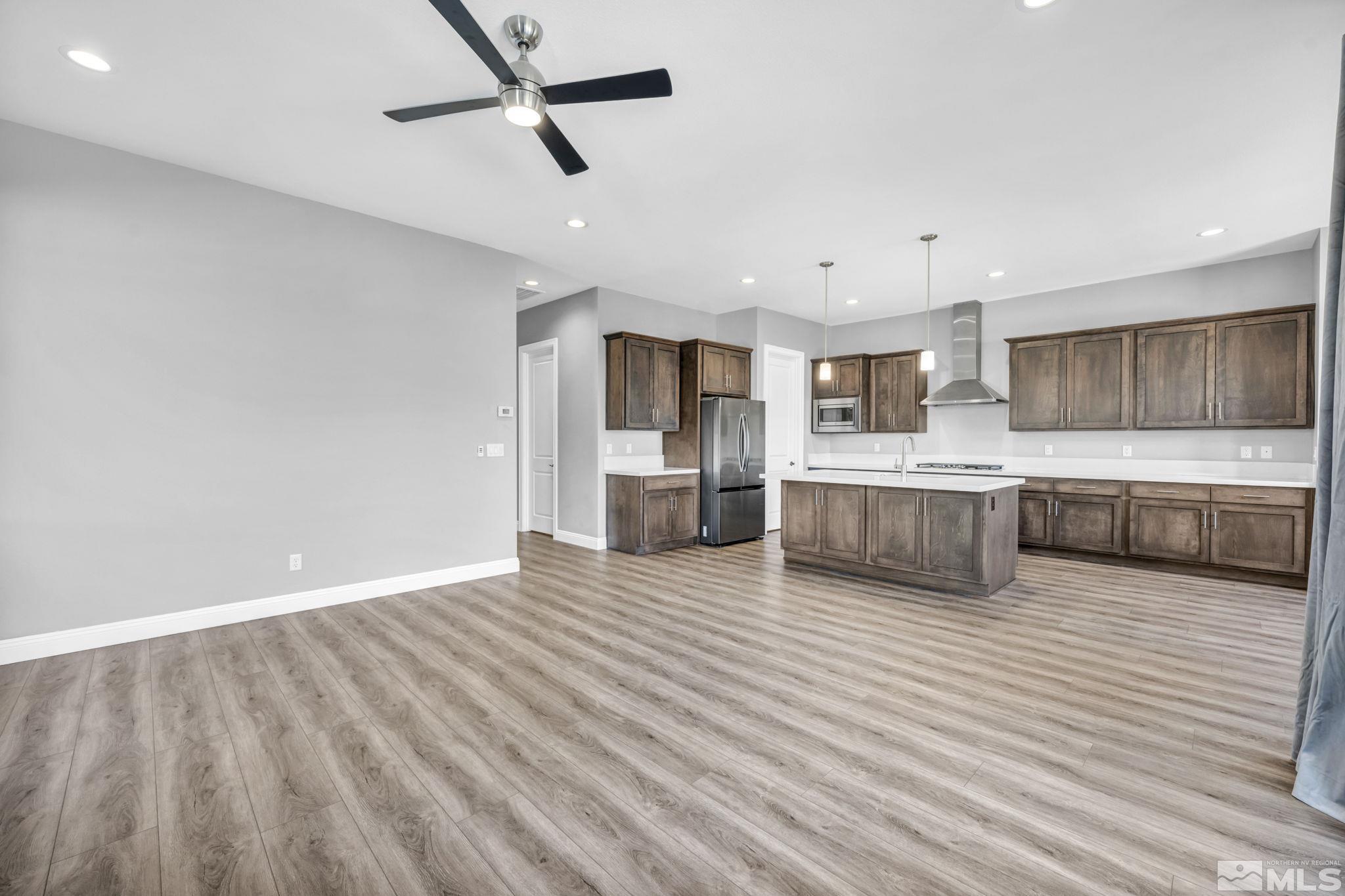 3108 Cambria Loop Carson City, NV 89703 - Photo 11 of 39 a view of a kitchen with wooden floor and a sink
