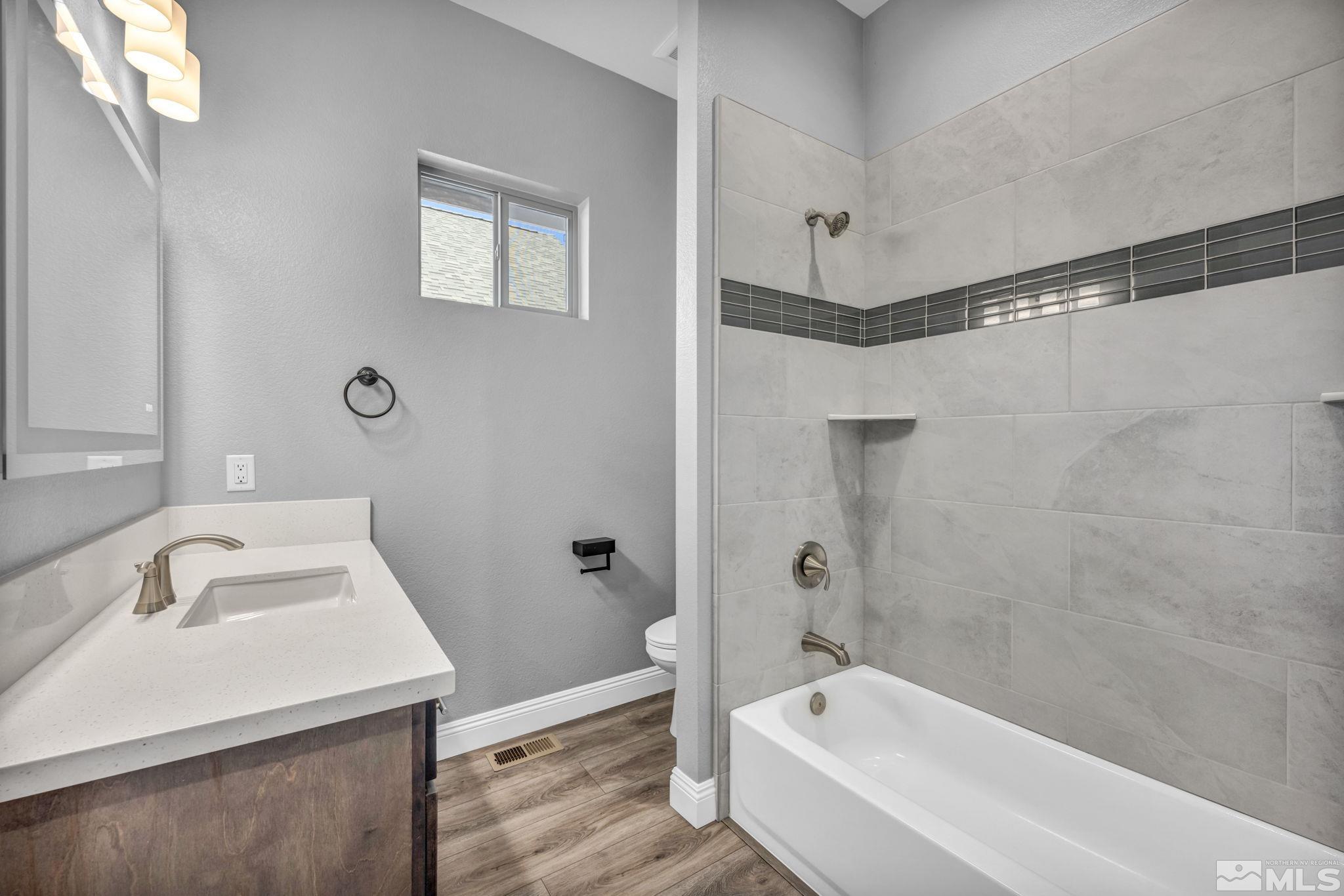 3108 Cambria Loop Carson City, NV 89703 - Photo 19 of 39 a bathroom with a sink a bathtub and shower