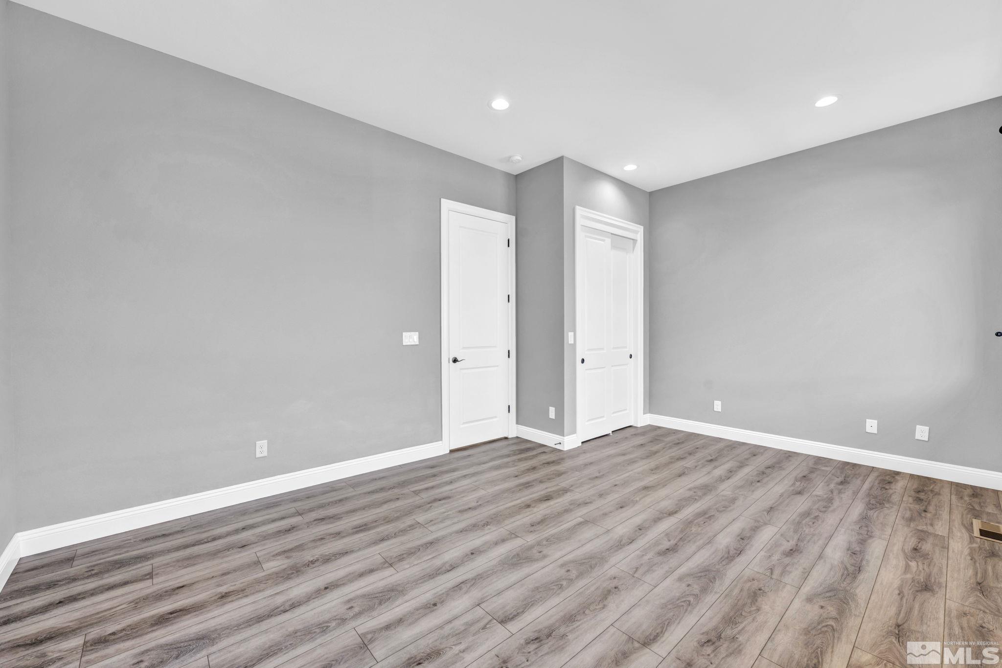 3108 Cambria Loop Carson City, NV 89703 - Photo 22 of 39 a view of an empty room with wooden floor