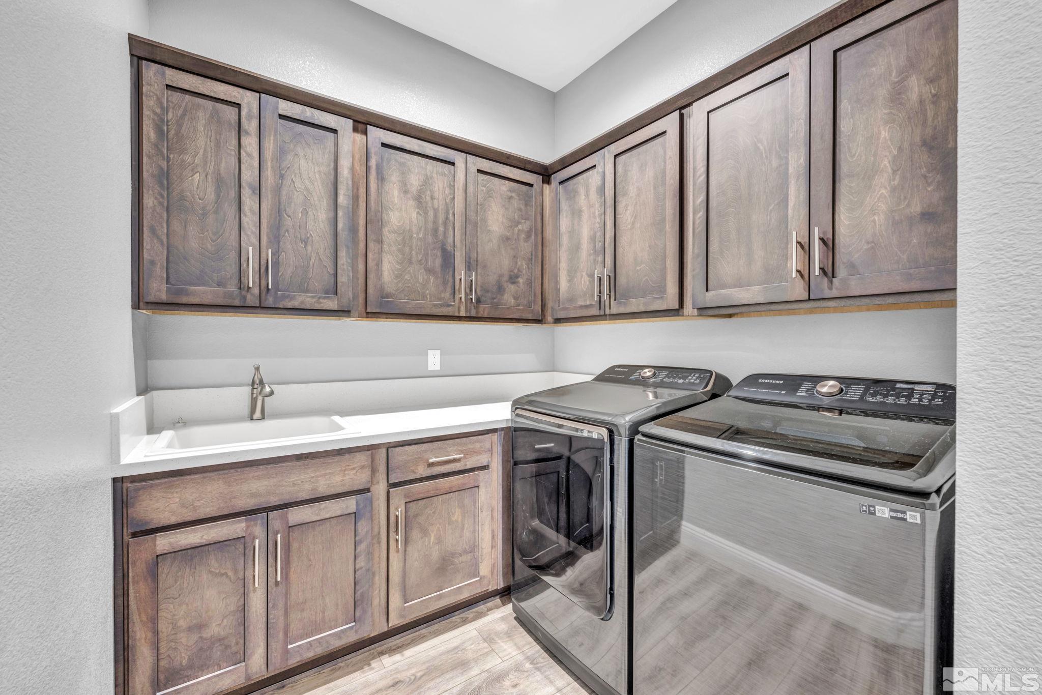 3108 Cambria Loop Carson City, NV 89703 - Photo 23 of 39 a kitchen with a sink stove and cabinets
