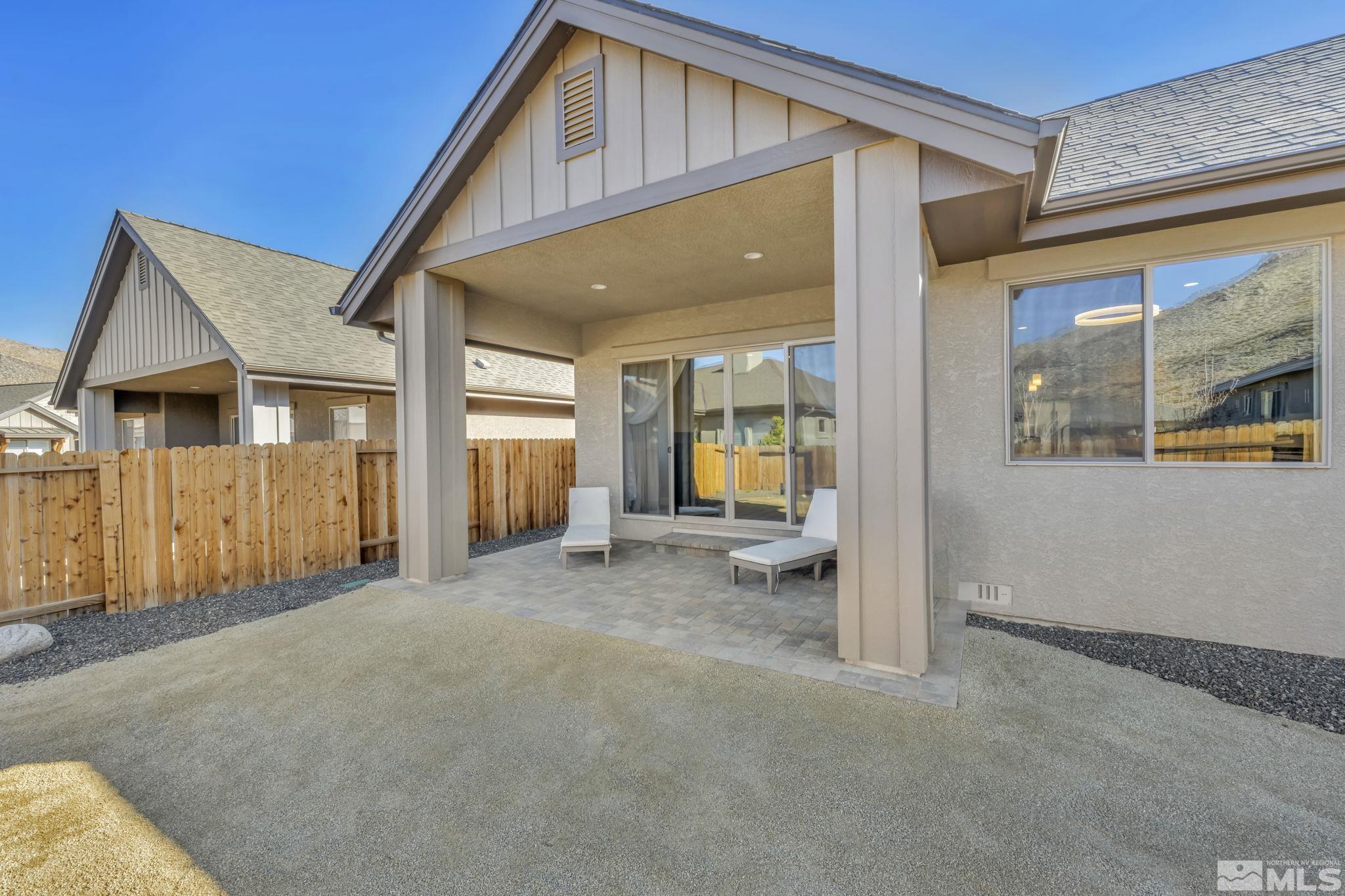 3108 Cambria Loop Carson City, NV 89703 - Photo 32 of 39 a view of a house with a backyard