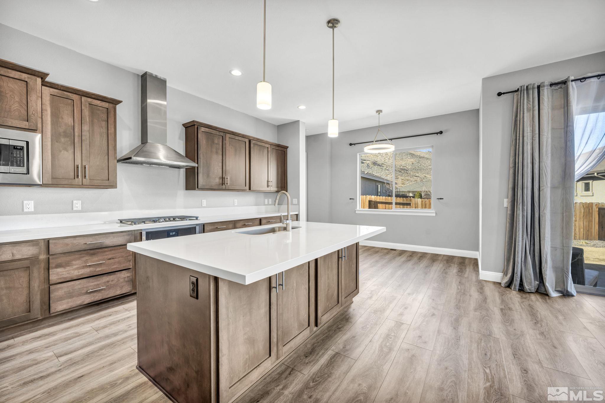 3108 Cambria Loop Carson City, NV 89703 - Photo 8 of 39 a kitchen with a stove window and wooden floor