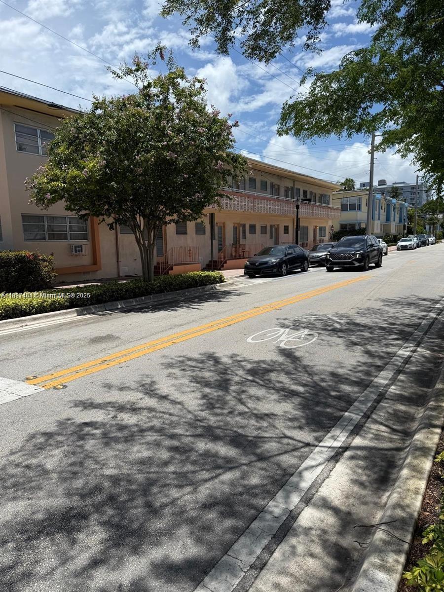 1060 Pennsylvania Avenue, Unit 18 Miami Beach, FL 33139 - Photo 11 of 21 a swimming pool with outdoor seating and yard