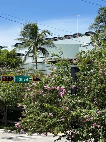 a view of front door with wooden floor