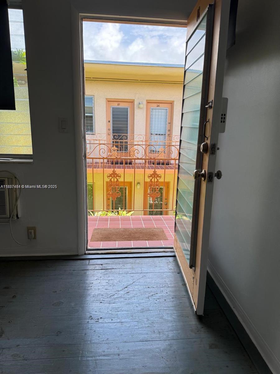 1060 Pennsylvania Avenue, Unit 18 Miami Beach, FL 33139 - Photo 14 of 21 a view of front door with wooden floor