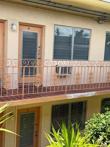 a view of balcony with wooden floor