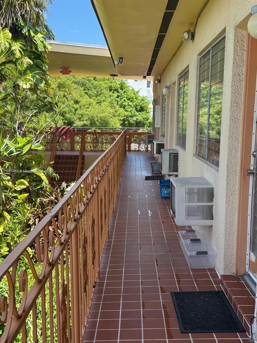 1060 Pennsylvania Avenue, Unit 18 Miami Beach, FL 33139 - Photo 18 of 21 a view of balcony with wooden floor