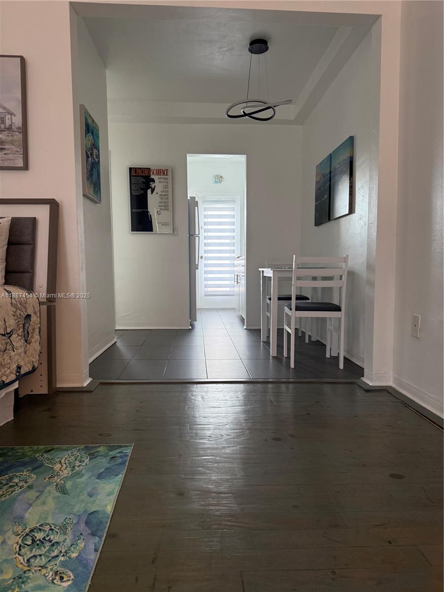 1060 Pennsylvania Avenue, Unit 18 Miami Beach, FL 33139 - Photo 2 of 21 a view of a livingroom with furniture and a flat screen tv