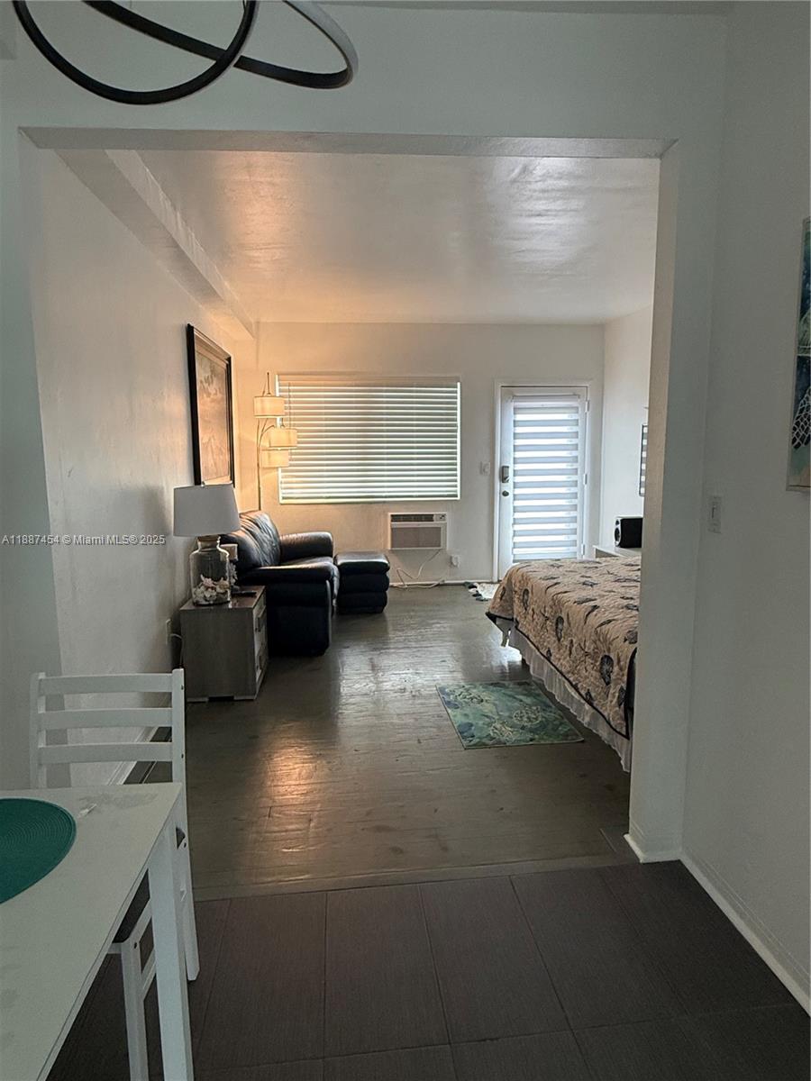 1060 Pennsylvania Avenue, Unit 18 Miami Beach, FL 33139 - Photo 10 of 21 a living room with furniture and a window