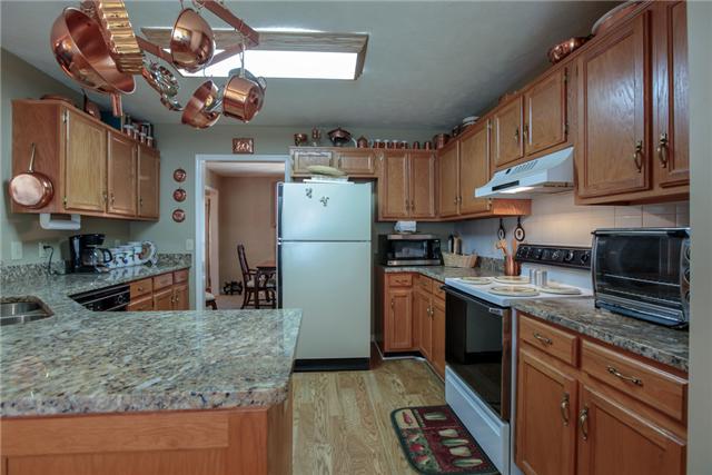 5533 Seesaw Road Nashville, TN 37211 - Photo 8 of 19 Come and cook in this adorable kitchen with granite countertops!