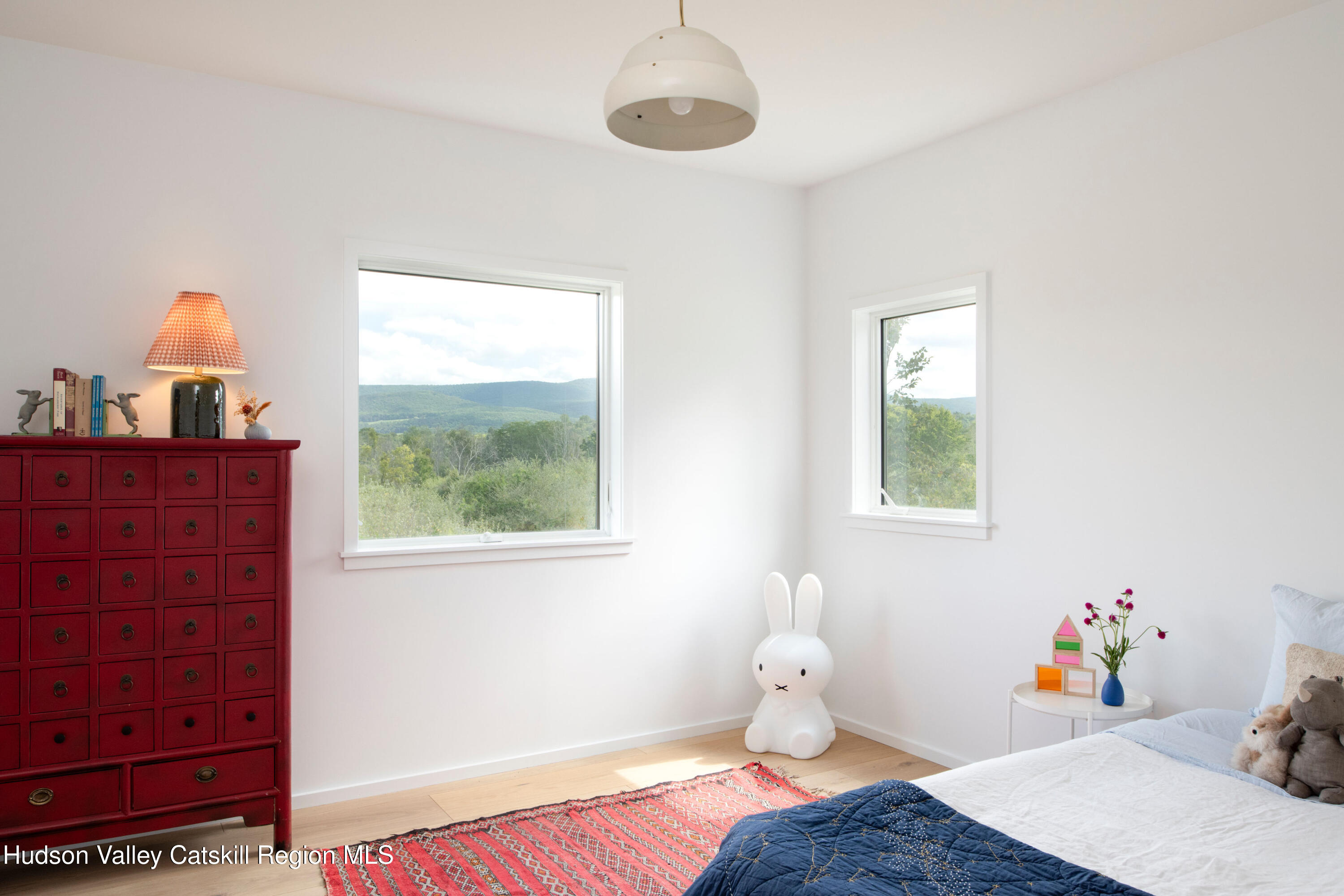 78 Waldorf Ridge Road Copake, NY 12516 - Photo 19 of 50 a bedroom with a bed and wooden floor