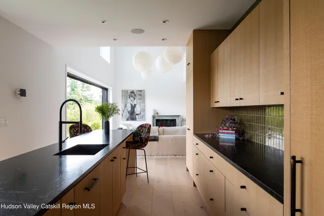 a kitchen with counter top space and cabinets