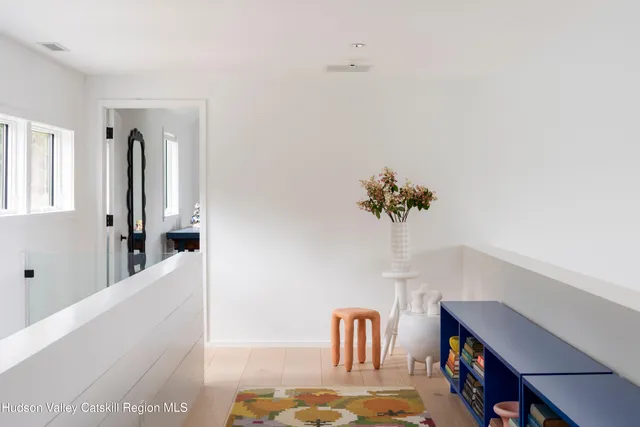 a bed room with a bed and a large window