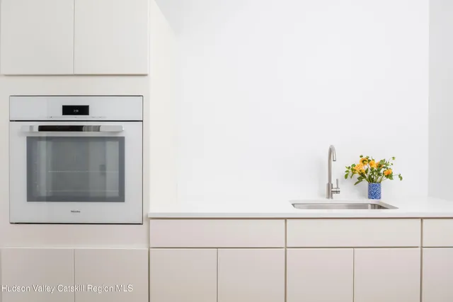 a bedroom with furniture and a wooden floor