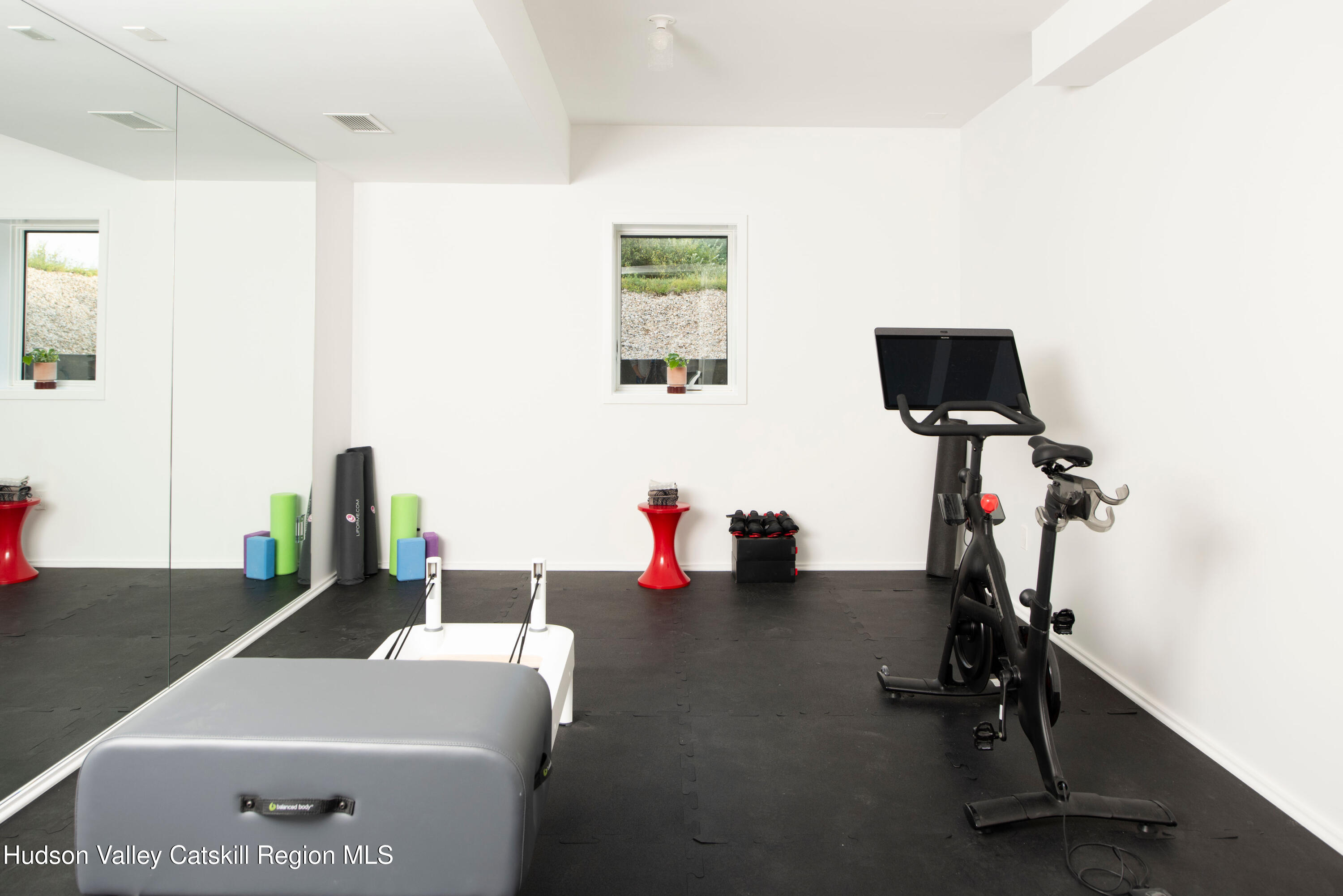 78 Waldorf Ridge Road Copake, NY 12516 - Photo 42 of 50 a room with gym equipment and a window