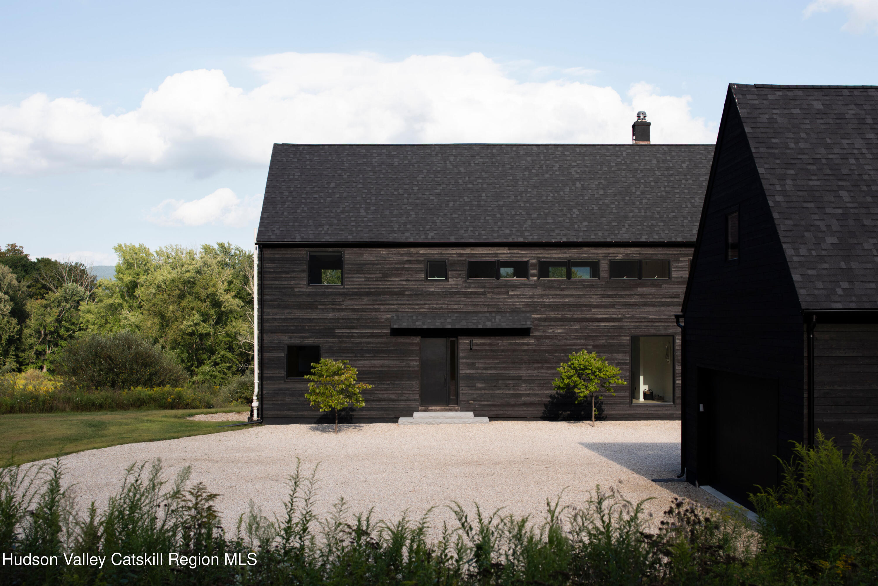 78 Waldorf Ridge Road Copake, NY 12516 - Photo 45 of 50 a front view of a house with a garden