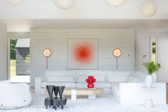 a living room with a sink and a potted plant