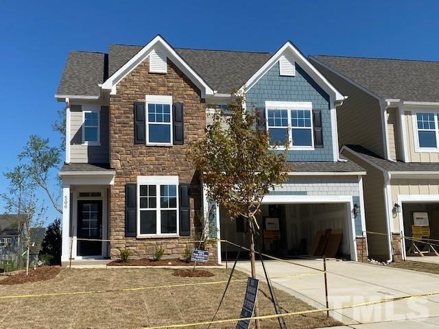 515 Ressler Street, Unit 560 Holly Springs, NC 27540 - Photo 1 of 1 a front view of a house with a yard