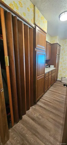 a bedroom with a bed and wooden furniture