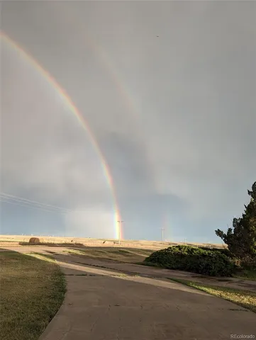 a view of ocean with a big yard