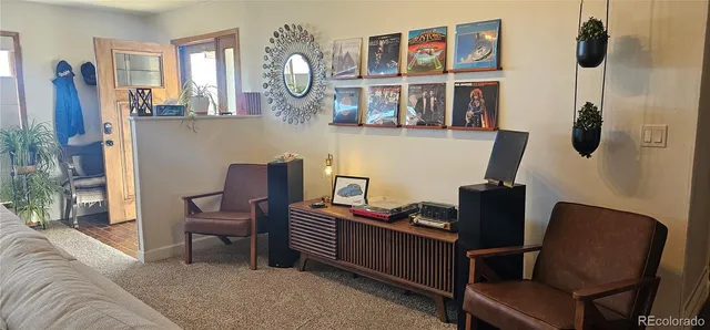 a view of a livingroom with furniture and windows