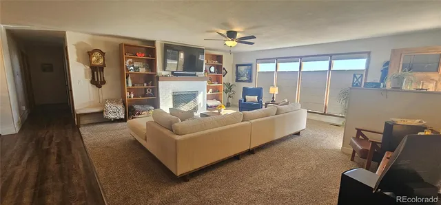 a living room with furniture and large window