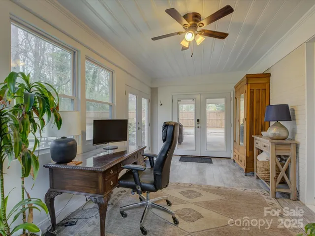 a workspace with furniture and a potted plant
