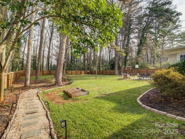 a view of a park with large trees