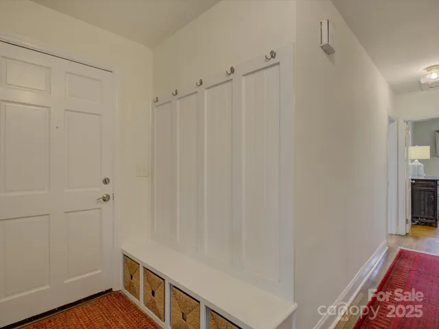 a view of an empty room with a fireplace