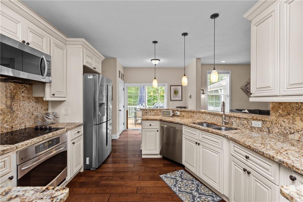158 Hammond Road Mars, PA 16046 - Photo 4 of 49 a kitchen with stainless steel appliances granite countertop a stove a sink and a refrigerator