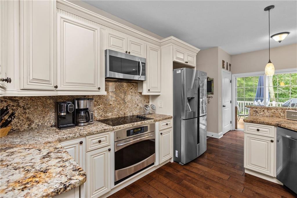 158 Hammond Road Mars, PA 16046 - Photo 5 of 49 a kitchen with stainless steel appliances granite countertop a stove a refrigerator and a microwave