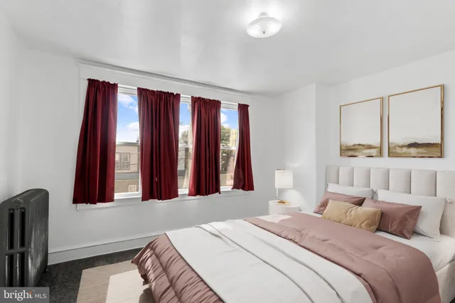 a bedroom with a bed and window