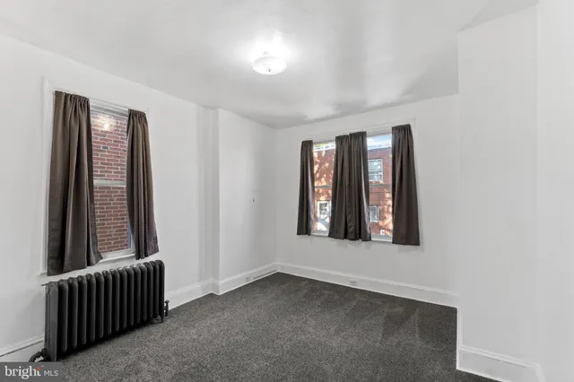 an empty room with windows