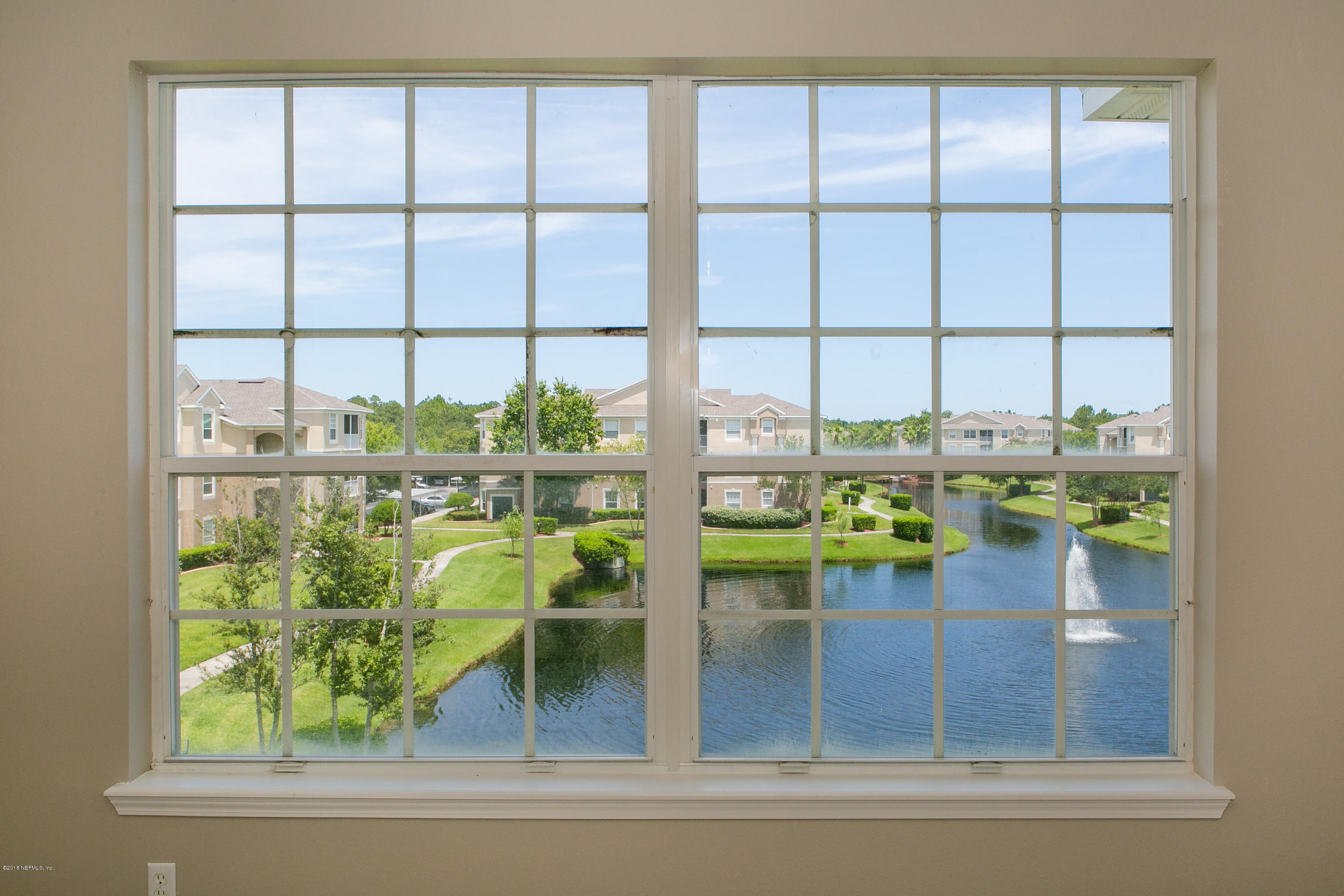 7990 Baymeadows Road, Unit 714 Jacksonville, FL 32256 - Photo 9 of 38 Pond View from Family Room