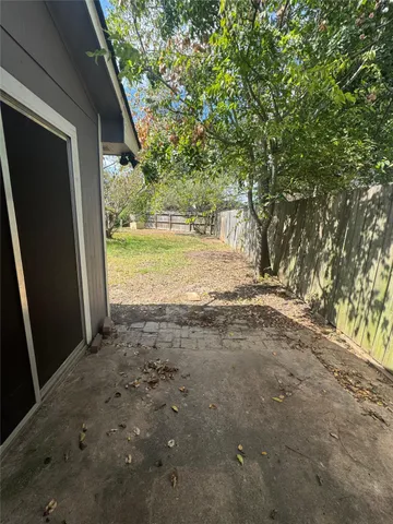a view of backyard with green space