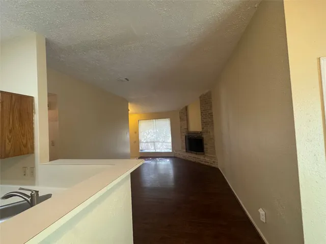 a view of an empty room and a window